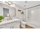 Bathroom featuring modern lighting, vanity with gold hardware, and shower-tub combo with neutral finishes at 8619 N 67Th Dr, Peoria, AZ 85345