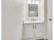 Bathroom boasts vanity with brushed gold hardware, a neutral palette and textured walls at 8619 N 67Th Dr, Peoria, AZ 85345