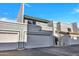 Charming townhome featuring attached garage, well-maintained landscaping, and red tile roof detail at 8619 N 67Th Dr, Peoria, AZ 85345