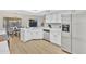 Bright kitchen with stainless steel appliances, white cabinetry, and a breakfast nook with backyard views at 8619 N 67Th Dr, Peoria, AZ 85345