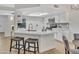 Modern kitchen with stainless appliances, breakfast bar, and skylight offers a bright and inviting space at 8619 N 67Th Dr, Peoria, AZ 85345