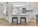 Modern kitchen with stainless appliances, breakfast bar, and skylight offers a bright and inviting space at 8619 N 67Th Dr, Peoria, AZ 85345