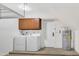 Laundry room with cabinets, water heater and newer washer/dryer at 8619 N 67Th Dr, Peoria, AZ 85345