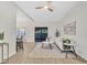 Spacious living area with laminate floors, ceiling fan and sliding door to patio, perfect for entertaining at 8619 N 67Th Dr, Peoria, AZ 85345