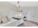 Bright main bedroom with vaulted ceilings, neutral color palette, and a cozy seating area at 8619 N 67Th Dr, Peoria, AZ 85345