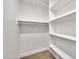 Walk-in closet with built-in shelving and ample storage space at 8619 N 67Th Dr, Peoria, AZ 85345