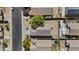 Aerial view of the property and the surrounding neighborhood, including the backyard and partial view of the street at 8753 E Plata Ave, Mesa, AZ 85212