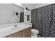 The bathroom features a patterned shower curtain and a mirrored wall at 8753 E Plata Ave, Mesa, AZ 85212