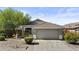 Charming single-Gathering home with a two-car garage and desert landscaping at 8753 E Plata Ave, Mesa, AZ 85212