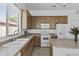 This kitchen offers ample counter space, modern appliances, and natural light from a nearby window at 8753 E Plata Ave, Mesa, AZ 85212