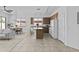 Bright kitchen features an island, a dining table, tile floor and plenty of natural light at 8753 E Plata Ave, Mesa, AZ 85212