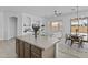 View of the kitchen island and the living area at 8753 E Plata Ave, Mesa, AZ 85212