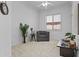 This living room area showcases a comfortable chair and a view of the front door at 8753 E Plata Ave, Mesa, AZ 85212