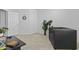 This living room area showcases a comfortable couch and a view of the front door at 8753 E Plata Ave, Mesa, AZ 85212