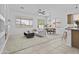 Open concept living area with carpet, tile, and lots of natural light at 8753 E Plata Ave, Mesa, AZ 85212
