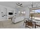 Open-concept living and dining area with sliding door access to the backyard at 8753 E Plata Ave, Mesa, AZ 85212