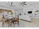 Open-concept living and dining area with stylish furniture and decor at 8753 E Plata Ave, Mesa, AZ 85212