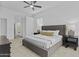 This main bedroom is spacious with a ceiling fan and neutral colors at 8753 E Plata Ave, Mesa, AZ 85212