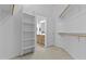 This walk-in closet provides ample storage space with shelving and hanging racks at 8753 E Plata Ave, Mesa, AZ 85212
