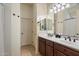 Bathroom with dual sinks, lots of counter space and a separate toilet room at 8820 E Ivy Cir, Mesa, AZ 85207
