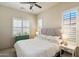 Bedroom with plantation shutters and light gray paint at 8820 E Ivy Cir, Mesa, AZ 85207