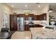 Well-equipped kitchen with stainless steel appliances, granite countertops, and ample cabinet space at 8820 E Ivy Cir, Mesa, AZ 85207