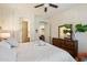 Comfortable main bedroom features neutral walls and ensuite bathroom access at 8820 E Ivy Cir, Mesa, AZ 85207