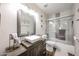 Bathroom featuring decorative mirror and vessel sink at 9085 E Windrose Dr, Scottsdale, AZ 85260