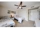 Bedroom featuring a ceiling fan, two beds and a closet at 9085 E Windrose Dr, Scottsdale, AZ 85260