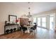 Elegant dining room featuring a round table, chandelier, and stylish decor at 9085 E Windrose Dr, Scottsdale, AZ 85260