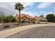 Inviting single-story home boasting desert landscaping and a prominent palm tree at 9085 E Windrose Dr, Scottsdale, AZ 85260