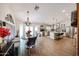 Open concept eat-in kitchen featuring a center island, stainless steel appliances, and bar seating at 9085 E Windrose Dr, Scottsdale, AZ 85260