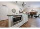 Kitchen island with a stainless steel microwave and granite countertops at 9085 E Windrose Dr, Scottsdale, AZ 85260