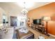 Spacious living area with stylish decor, wood-look floors, and integrated dining area at 9085 E Windrose Dr, Scottsdale, AZ 85260