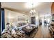 Open living room featuring neutral decor, hardwood floors, and stylish furniture at 9085 E Windrose Dr, Scottsdale, AZ 85260