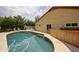 Backyard features a swimming pool, and a patio with seating, perfect for enjoying the outdoors at 9085 E Windrose Dr, Scottsdale, AZ 85260