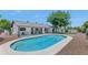 Private backyard oasis with pool, patio, and lush landscaping under a clear sky at 9450 N 83Rd Pl, Scottsdale, AZ 85258