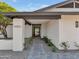 Modern entryway with sleek design elements, manicured landscaping, and a welcoming atmosphere at 9450 N 83Rd Pl, Scottsdale, AZ 85258