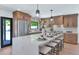 Beautiful kitchen featuring an island with seating and modern pendant lighting at 9450 N 83Rd Pl, Scottsdale, AZ 85258