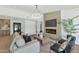 Cozy living room showcasing a fireplace, stylish seating, and modern design elements at 9450 N 83Rd Pl, Scottsdale, AZ 85258