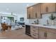 Inviting living space featuring a beverage cooler, custom cabinetry, and an open layout for seamless entertaining at 9450 N 83Rd Pl, Scottsdale, AZ 85258