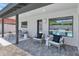Cozy outdoor patio with stylish seating, pavers, and a view of the pool and backyard at 9450 N 83Rd Pl, Scottsdale, AZ 85258