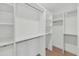 Spacious walk-in closet featuring custom shelving and ample storage space for an organized wardrobe at 9450 N 83Rd Pl, Scottsdale, AZ 85258