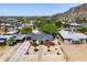 Charming home featuring mature landscaping, a quaint walkway, and views of a scenic mountain backdrop at 9520 N Central Ave, Phoenix, AZ 85020
