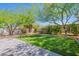 Expansive backyard featuring lush artificial turf and a paver patio, perfect for outdoor gatherings and relaxation at 9520 N Central Ave, Phoenix, AZ 85020