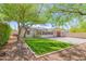 Expansive backyard features artificial turf, desert landscaping, and brick pavers, perfect for outdoor entertaining at 9520 N Central Ave, Phoenix, AZ 85020