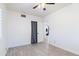 Bright bedroom with tile floors, large closet, ceiling fan, and neutral walls at 9520 N Central Ave, Phoenix, AZ 85020