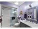 Modern bathroom with a glass-enclosed shower and vanity with sleek marble countertop at 961 Leisure World --, Mesa, AZ 85206