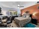 Spacious bedroom with a work area, comfortable bed, and natural light from the window at 961 Leisure World --, Mesa, AZ 85206