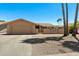Charming single-story home with a desert landscape, neutral color palette, and two car garage at 961 Leisure World --, Mesa, AZ 85206